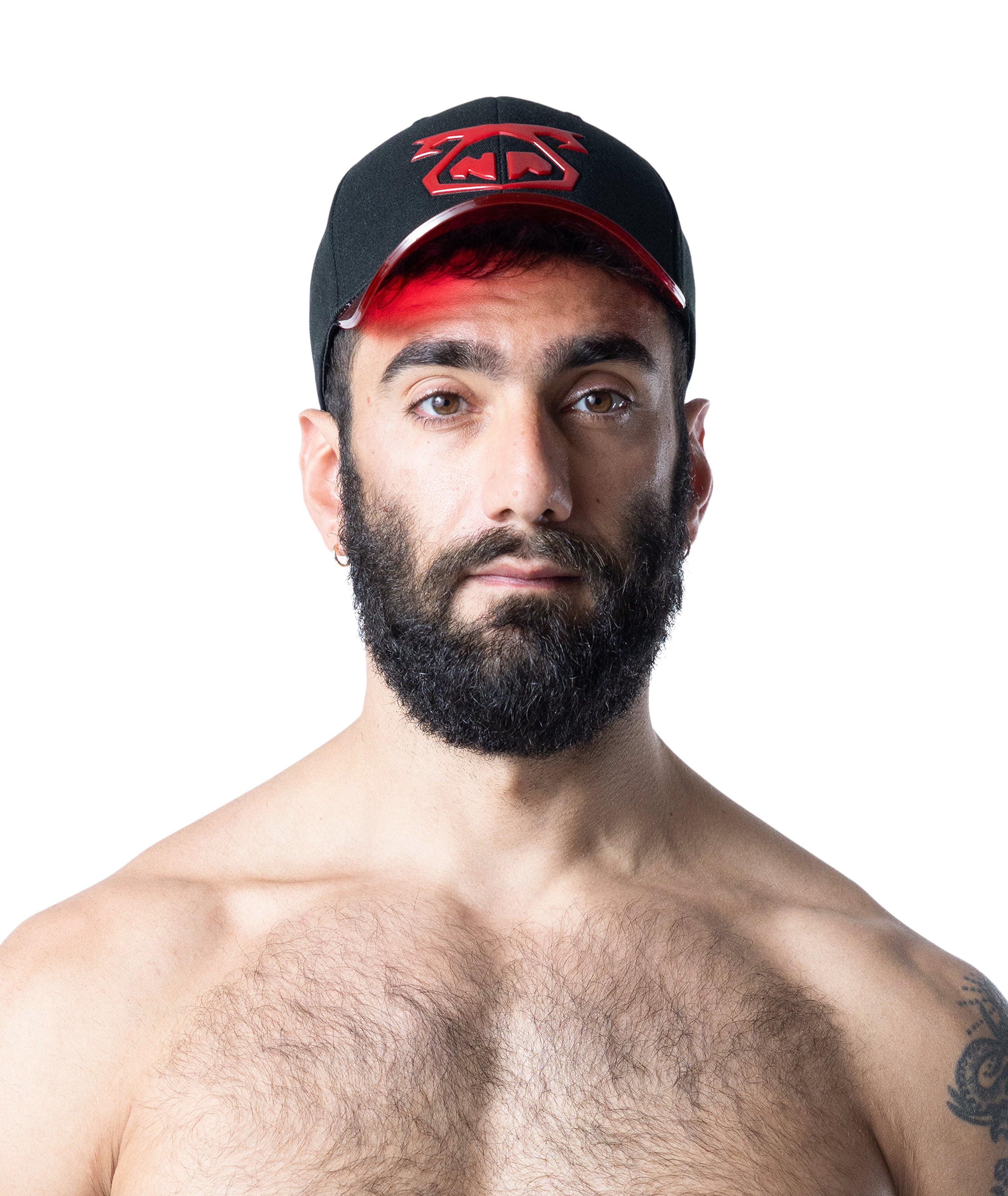 Man wearing a black cap with red accents on a white background