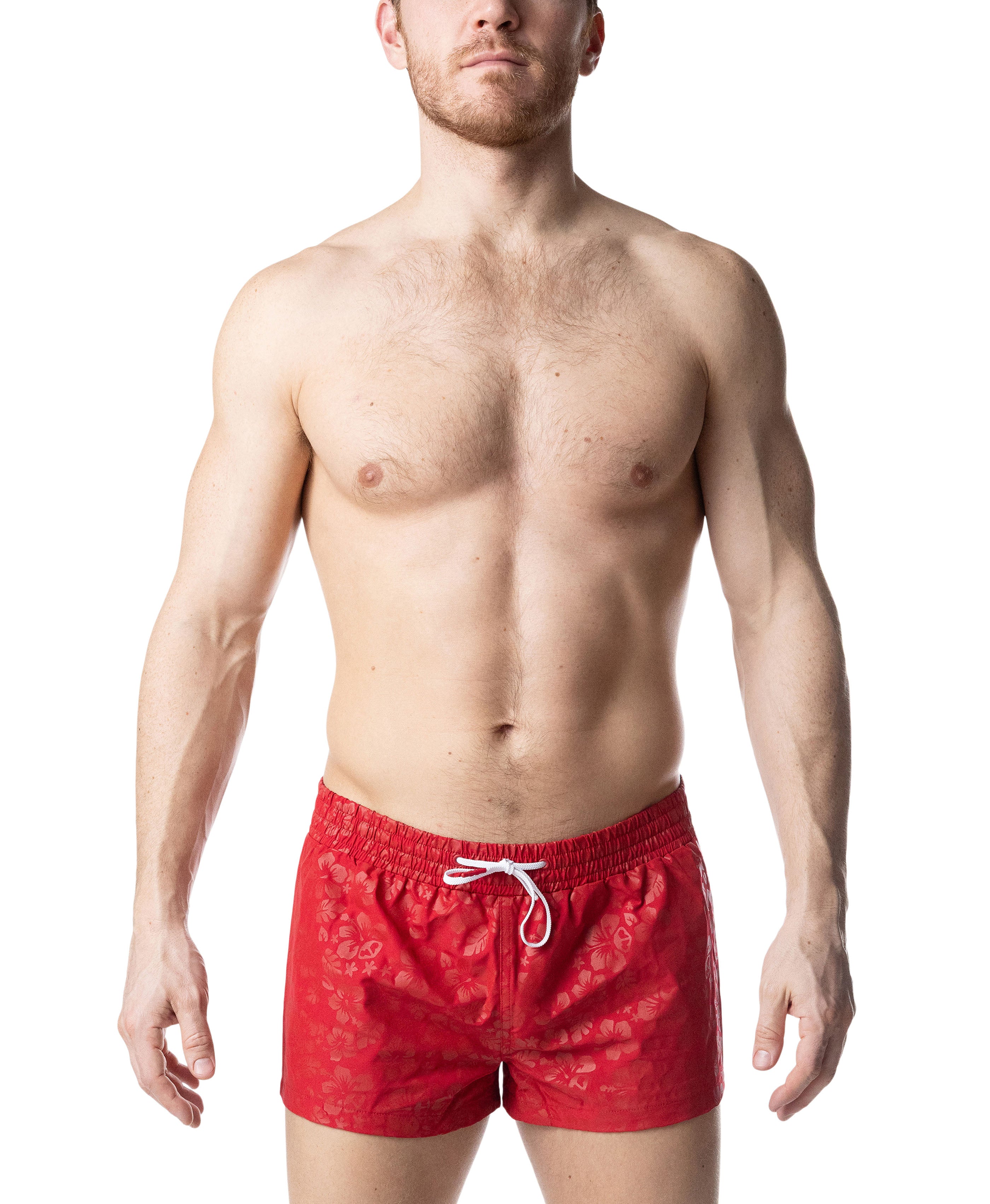 Man wearing red swim shorts on a white background