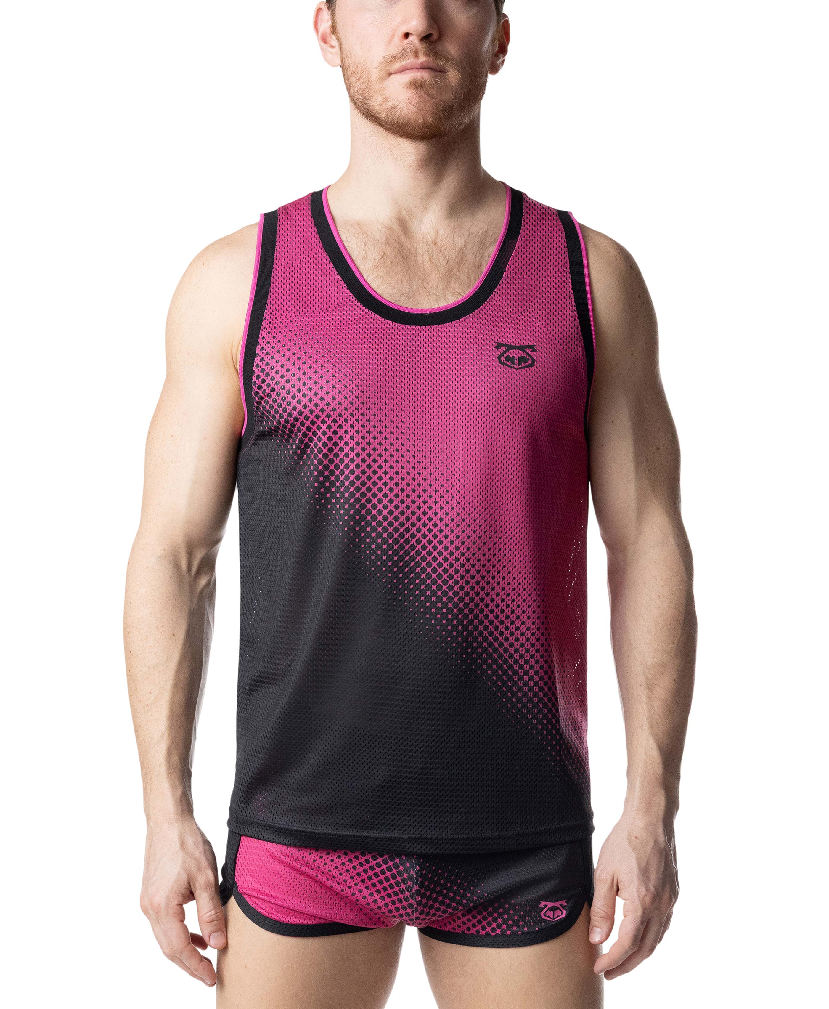 Person wearing a pink and black athletic tank top with matching shorts on a white background