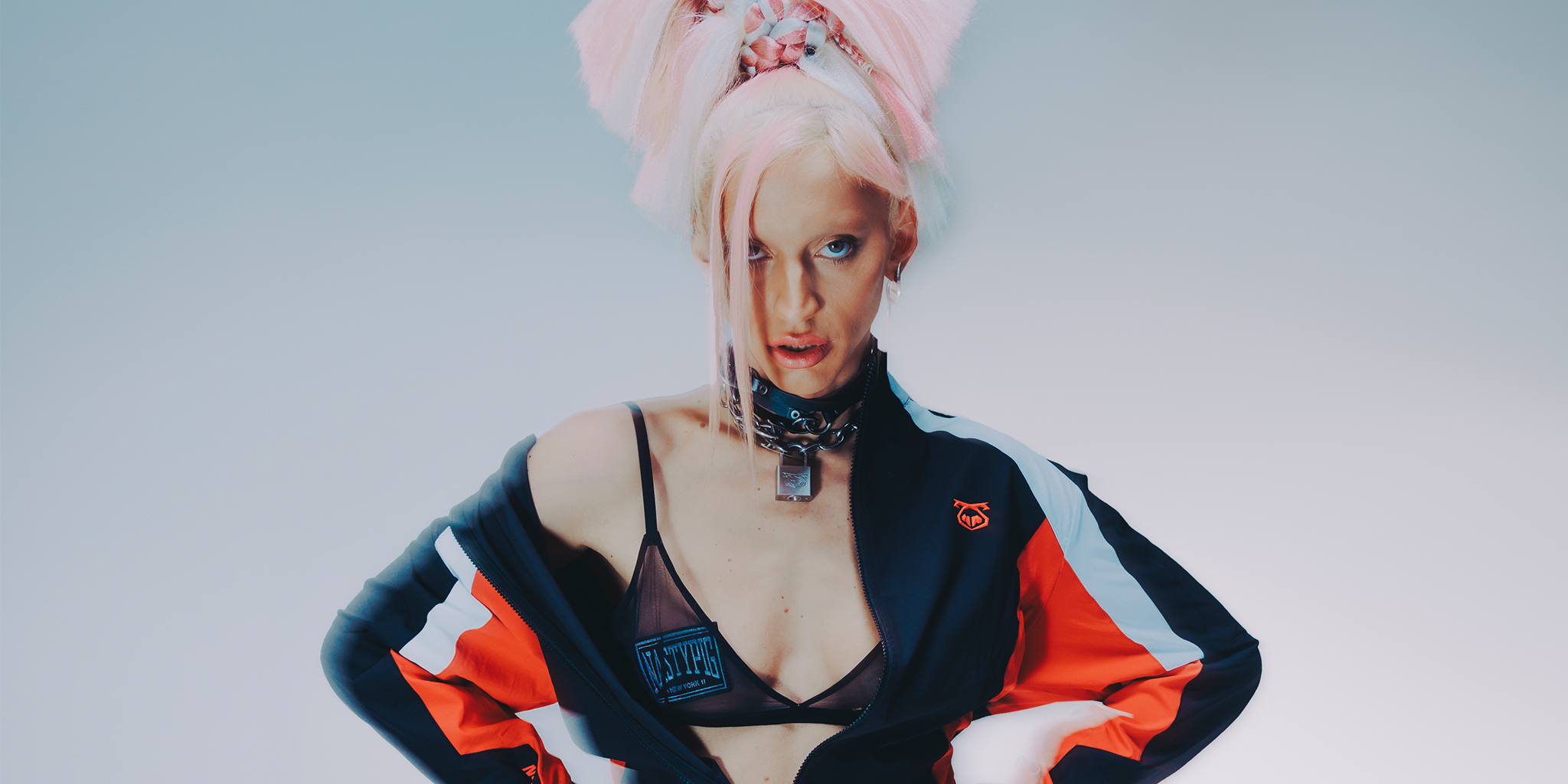 Model Linux wearing Nasty Pig Full Throttle clothing against gradient background