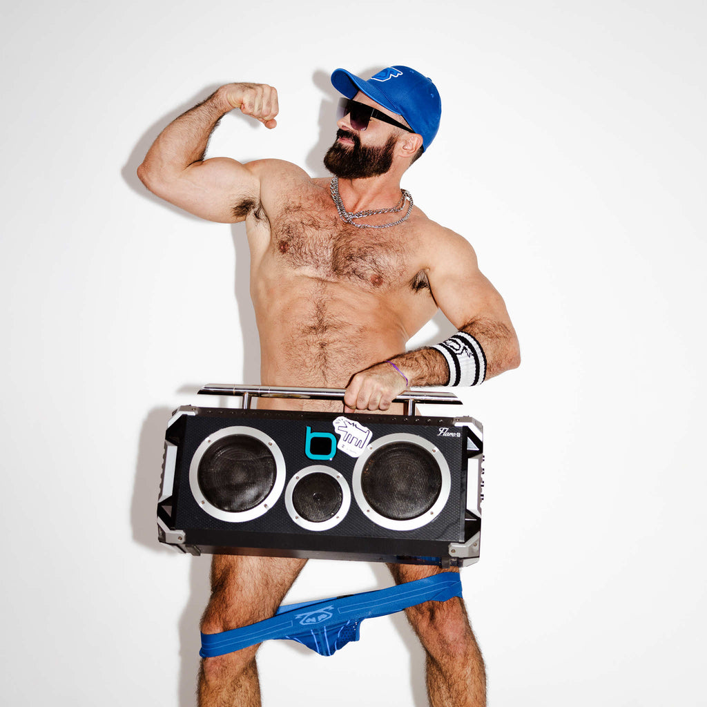 Facundo Rod - Real Nasty Pig of New York - Flexing his bicep while holding a boombox with a jockstrap around his knees