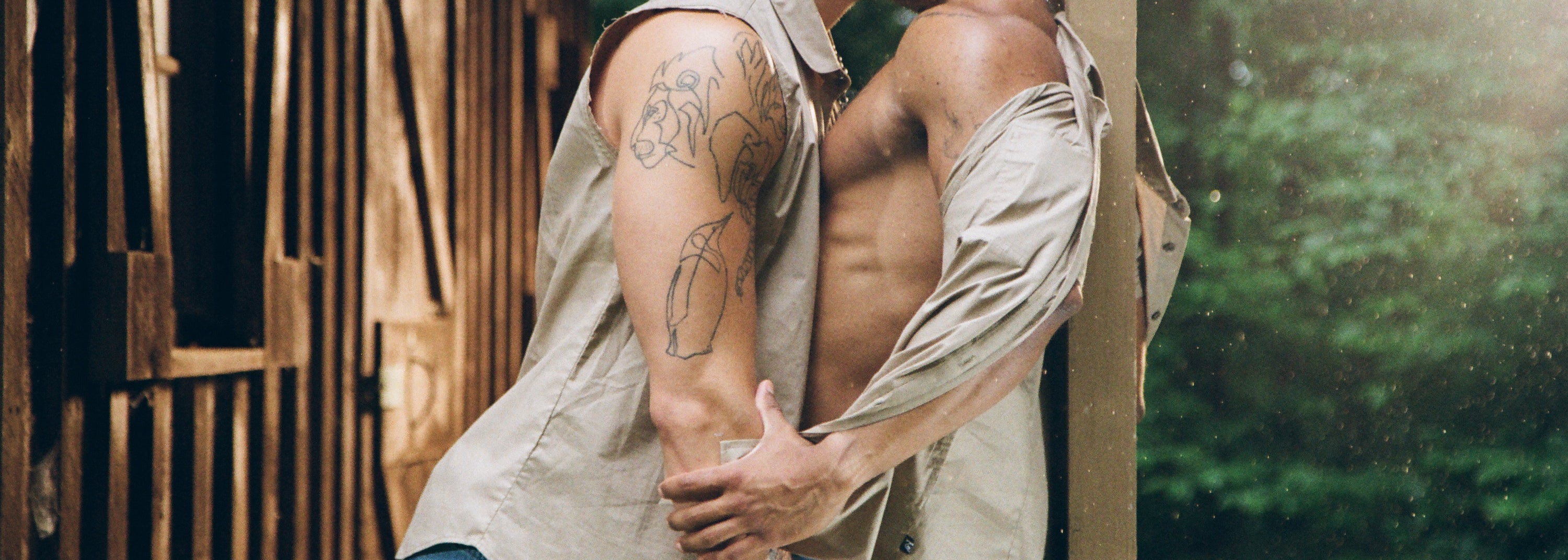 Two men kissing and embracing in the Endeavor Group from Nasty Pig