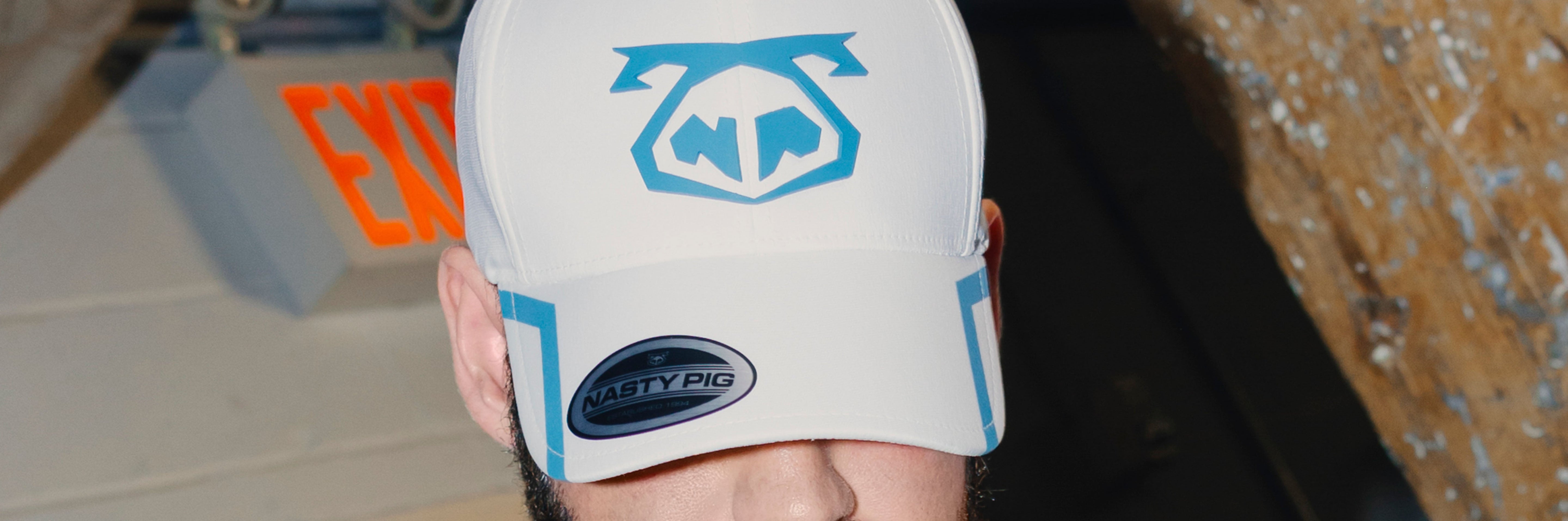 Two men wearing Snout Caps and kissing