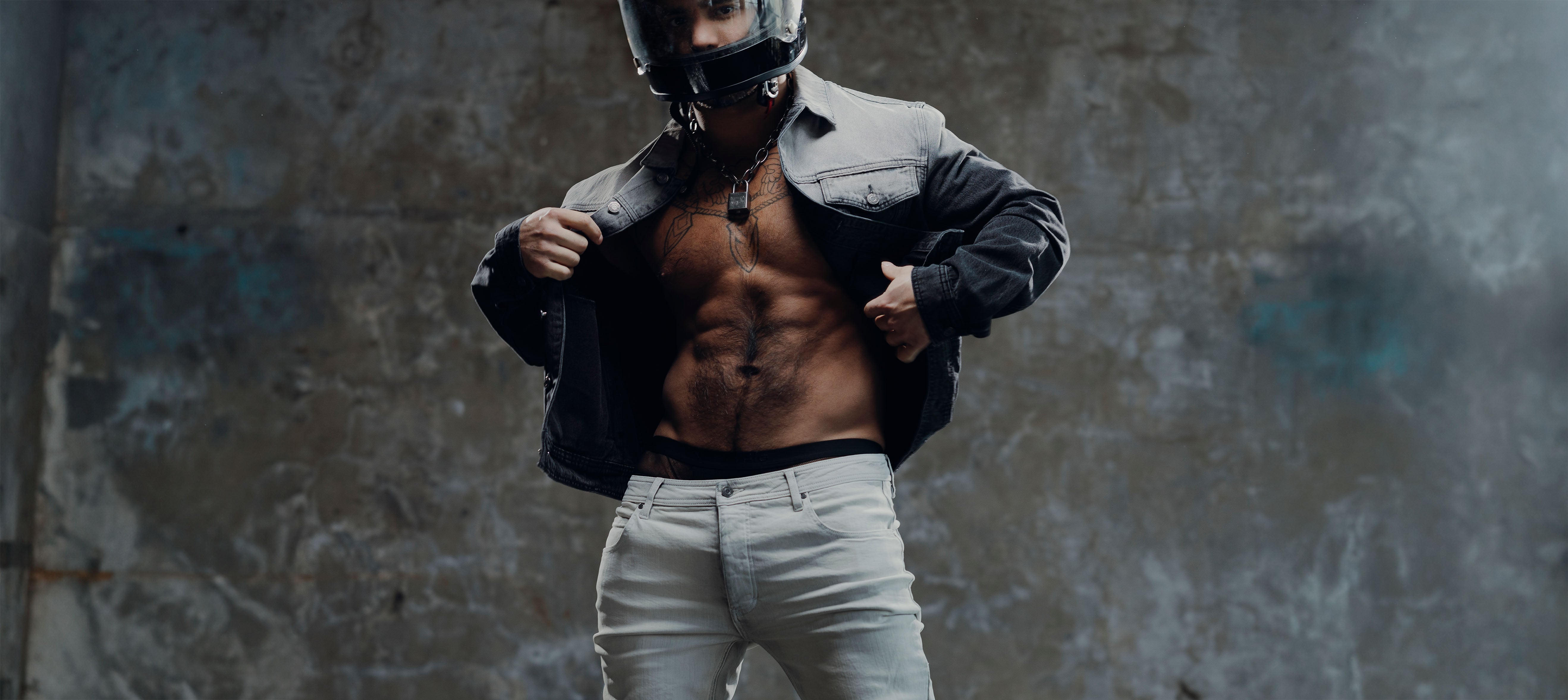 Man posing in Black Jacket with exposed rear