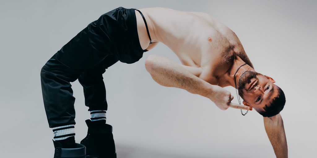 Male model wearing Nasty Pig on all fours.