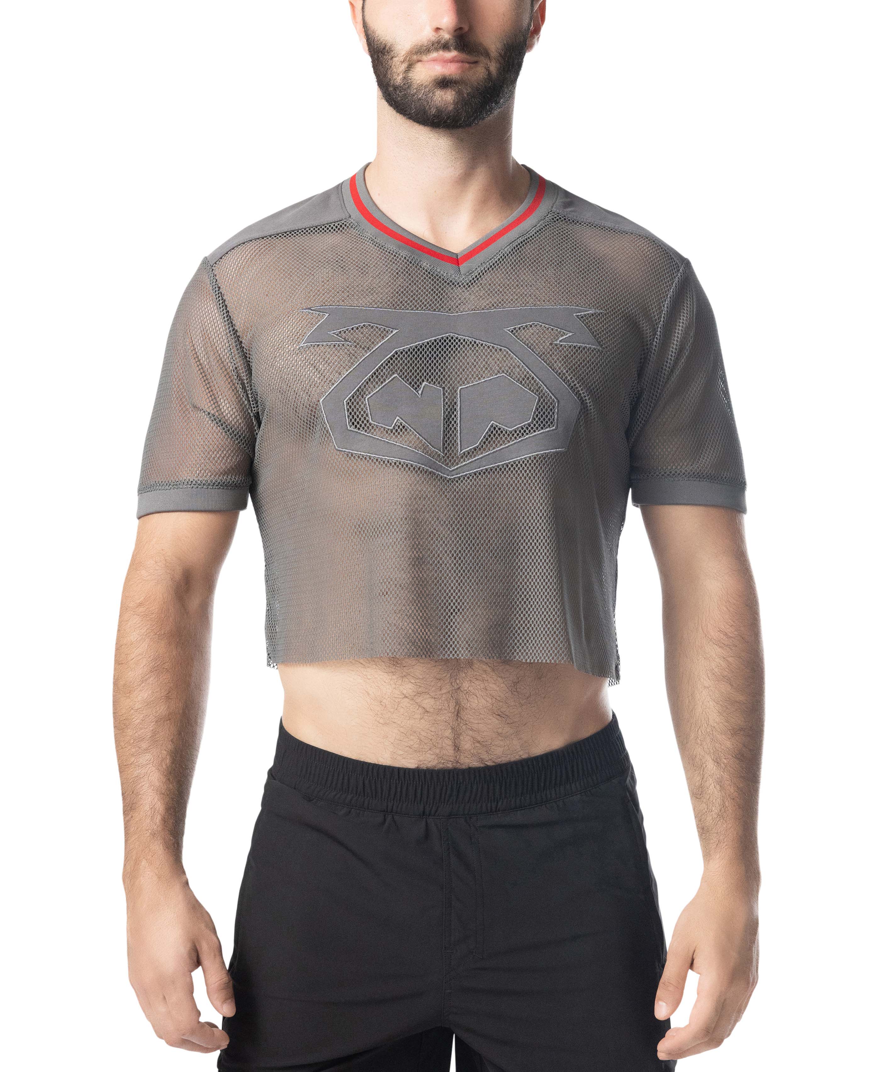 Man wearing a gray mesh athletic shirt with a logo on a white background