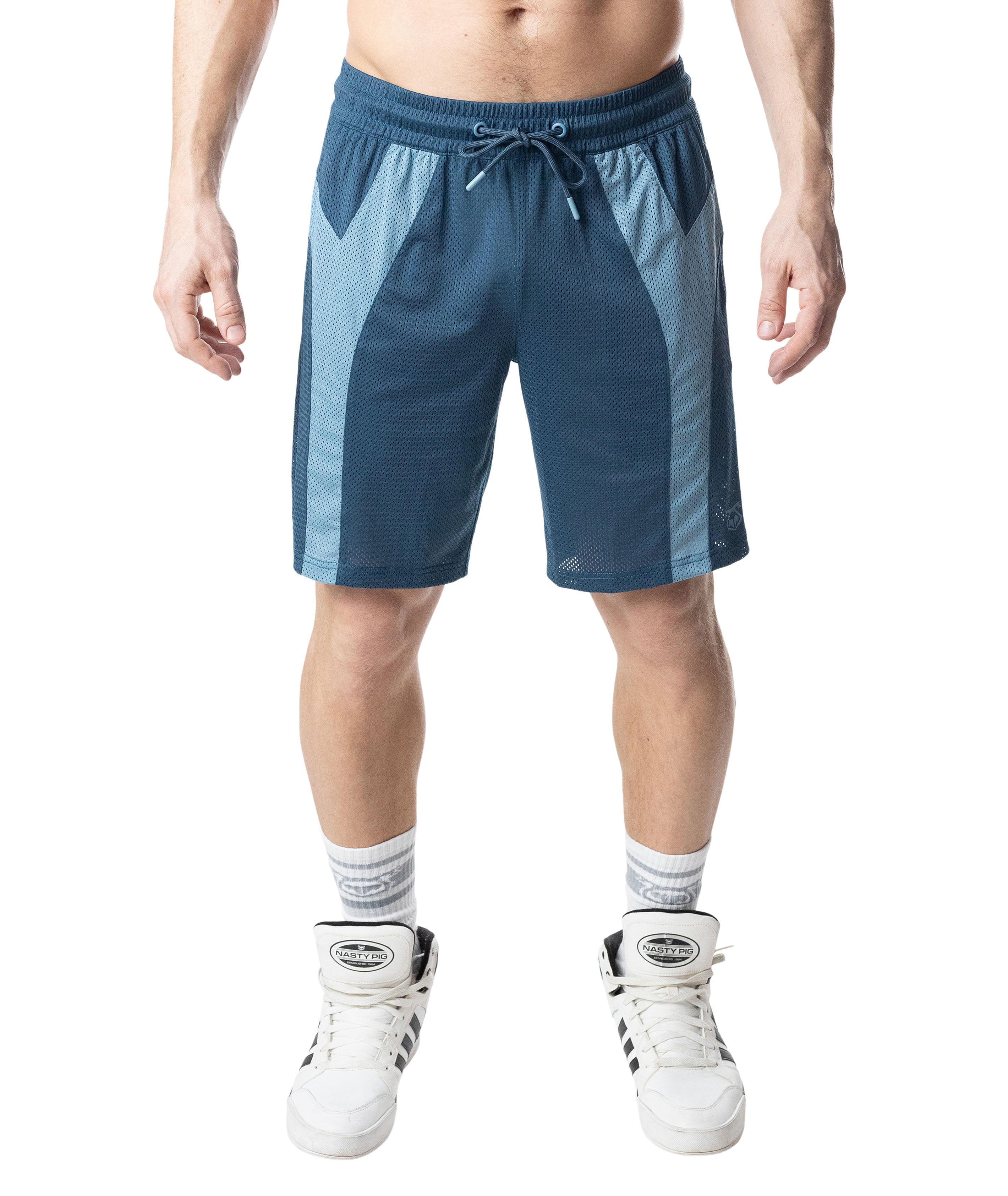 Person wearing blue athletic shorts on a white background