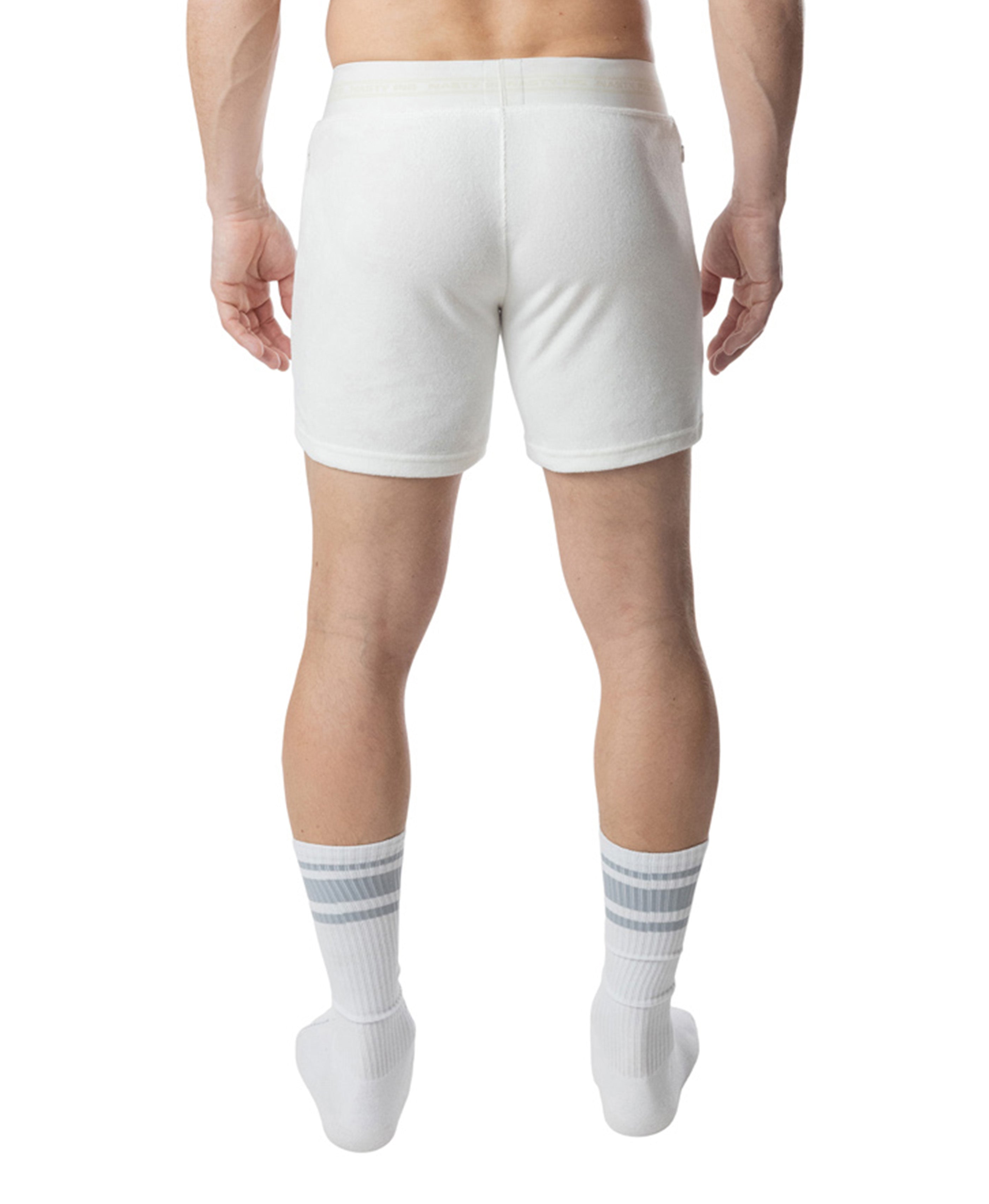 White athletic shorts worn by a person on a white background