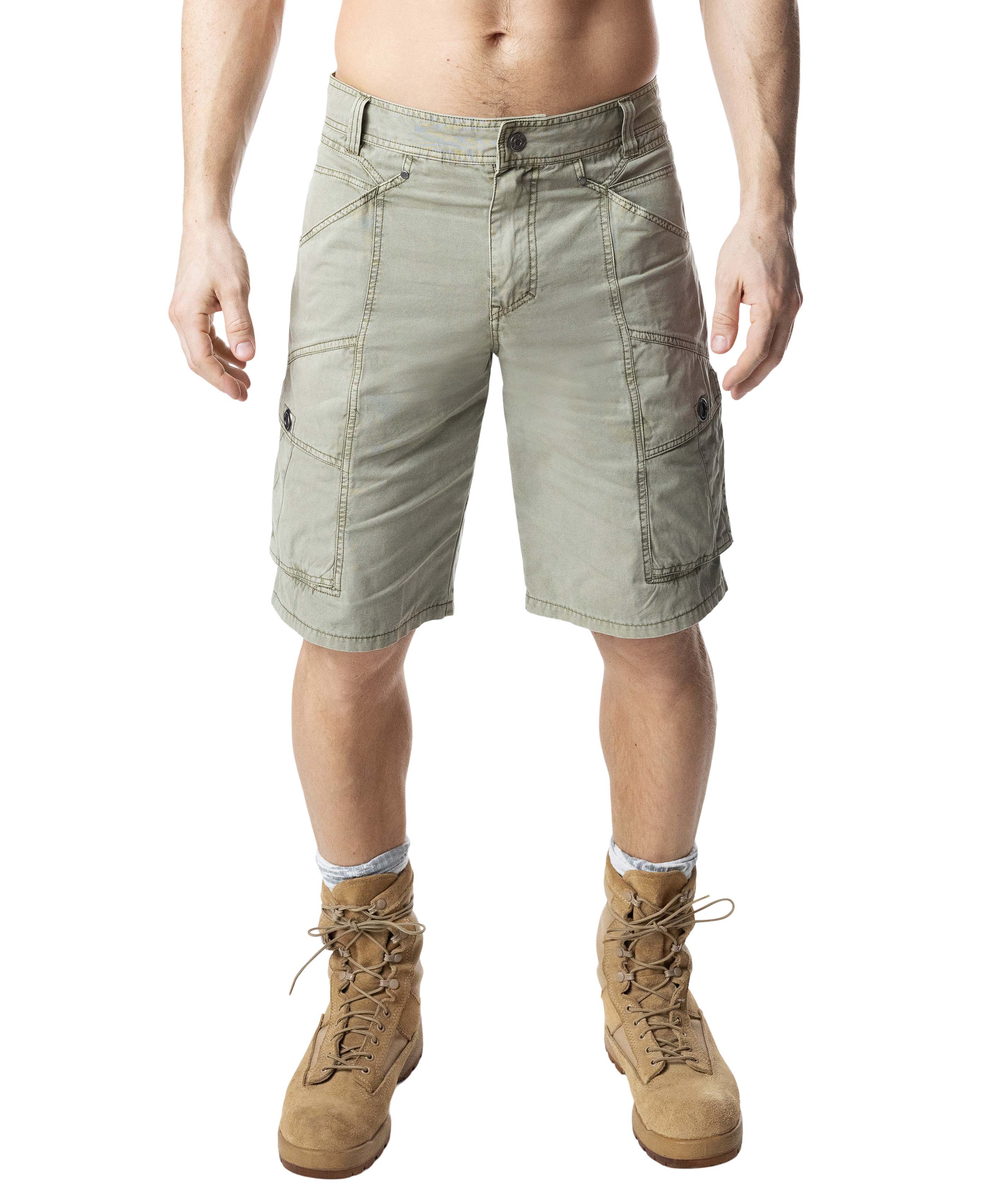Person wearing light green cargo shorts and tan boots on a white background